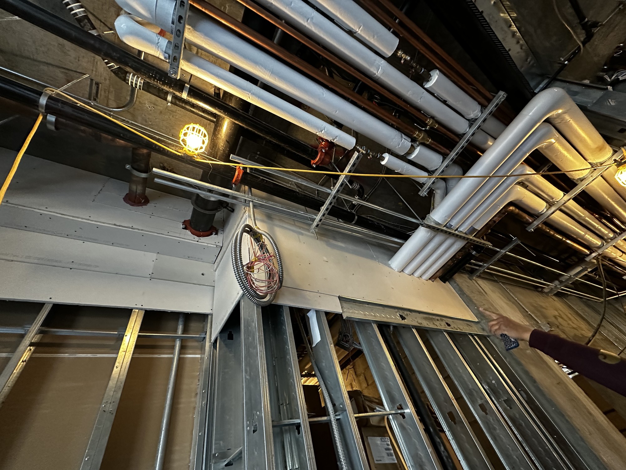 Exposed framing and building systems shown in the BAINS construction portfolio